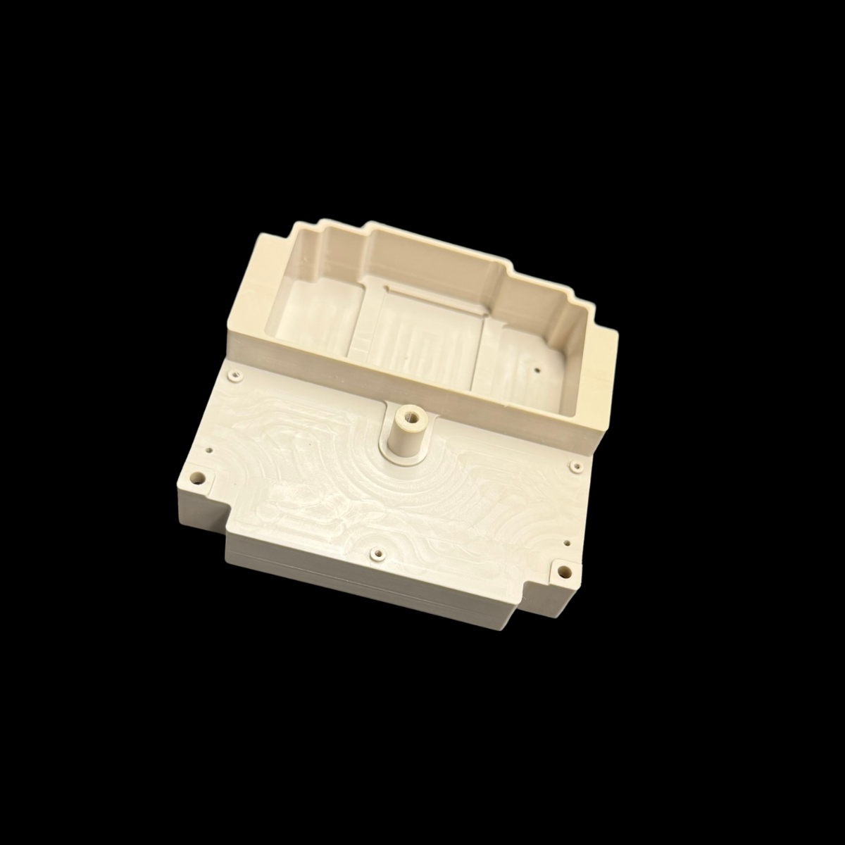 pièce technique en peek usinée 5 axes à paris, vue en perspective montrant les poches internes et perçages fonctionnels